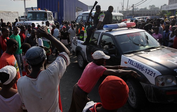 - feb 11 - Earthquake survivors shout at Haitian policemen